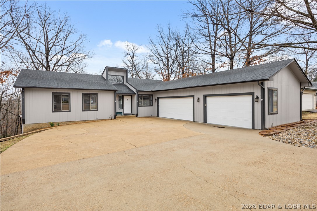 Experience Lake Ozark living in the Village of Four Seasons. Motivated Sellers! This meticulously updated, move-in-ready gem spans 5+ bedrooms & 3 baths, offering a rare layout designed for multi-generational living, dual-family ownership, or a high-yield investment. Renovated top to bottom, the interior shines with new tile entry, plush carpet, LED fixtures, ceiling fans, French doors & interior doors. The chef's kitchen boasts quartz countertops, tile backsplash, & new appliances. Retreat to the primary suite featuring a spa-like bath with a new quartz vanity. Convenience is key with a dedicated main-level laundry room complete with cabinetry & sink. Versatile Lower Level & ADU Potential as the walk-out lower level serves as true 2nd living quarters, featuring wood-plank laminate flooring, living room with gas fireplace, full kitchen, 2 BR, bonus room, & a 2nd laundry. Key features: 3-car heated garage + parking for 9 vehicles; Safe room (plumbed); 8 total appliances: 2 Refrigerators, 2 Dishwashers, 2 Stoves, 1 Washer, 1 Dryer; Water Softener-Owned; new water heater; 2-year-old roof, gutters, & fresh paint/trim.  Don't miss this one-of-a-kind, turn-key masterpiece!