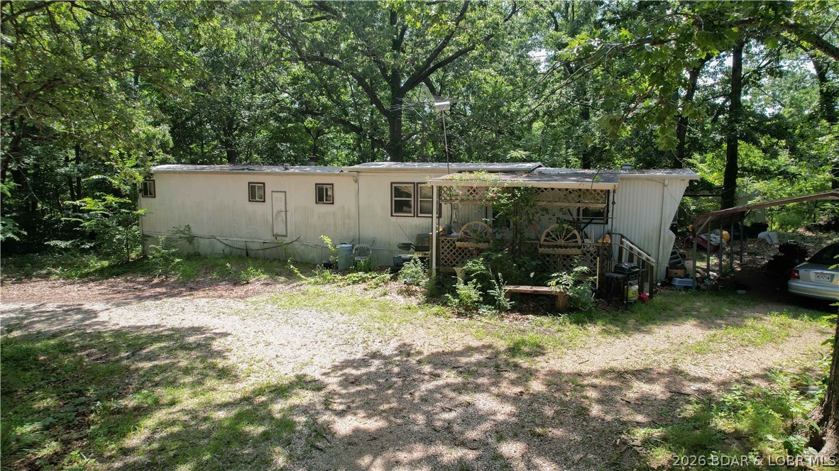 There is 5.3 acres of possibility. This expansive, mostly level parcel offers room to stretch out, dream big, and create your own private retreat. Tucked on the property is a 1-bedroom, 1-bath single-wide trailer—sold as-is—ready for a full makeover or removal to make way for your vision. Generous 5.3-acre lot with a mix of open space and natural privacy
Existing 1 bed / 1 bath trailer home (fixer upper, sold as-is)
Ideal canvas for a new build, barndominium, tiny home cluster, hobby farm, or weekend getaway
Ample space for gardens, workshops, RV/boat parking, and outdoor living
Potential to utilize existing site improvements (buyer to verify utilities, septic, and water source)
No known HOA; bring your ideas and make it your own
Property and structures sold strictly as-is, where-is
Cash or land-friendly financing may be best due to condition
Buyer to verify all measurements, zoning, access, and development options