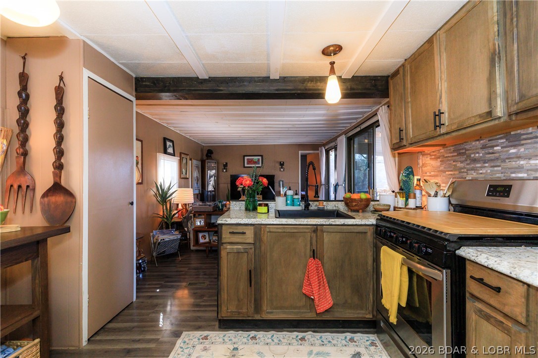 Welcome to 78 Betlo Park Drive in Sunrise Beach—an inviting, updated 2BR/2BA home ideally located at the 11MM of the Osage Arm, directly across from the Shawnee Bend boat launch. Enjoy easy access to open water, popular lakefront dining, and year-round recreation in a peaceful, private, pet-friendly community. Take in beautiful lake views from the welcoming front porch. Inside, this warm & cozy home features new subflooring, luxury vinyl plank flooring, an updated kitchen, upgraded lighting, & refreshed bathrooms w/ heated bidet seats. Additional features include central air & heat, smart thermostat, backup window unit, & a durable metal roof. Outdoor amenities include an insulated 9x12 man-cave/storage shed w/ electric & a new AC unit, a 3x5 metal tool shed, fishing rack, raised garden beds, propane grill, Big Green Egg smoker, & a bedroom window catio. The home is sold fully furnished w/ washer/dryer, major appliances, furniture, décor, and patio furnishings (excluding personal items). Situated on a leased lot ($850/month), the property includes a 10x20 boat slip with lift, plus access to a community pool and private swim dock—ideal for seasonal living or a weekend lake getaway.