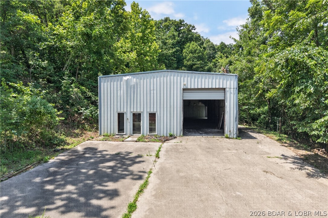 Endless potential awaits with this versatile 3,680-square-foot metal building situated on 5.2 acres, plus two additional non-contiguous parcels totaling over an acre with lakefront and lakeview opportunities. Whether you're looking for a workshop, warehouse, storage facility, business location, or the ultimate man cave to house your boats, PWC's, ATVs, and equipment, this property offers incredible flexibility. Property is Under Contract With a 72 Hour Kickout.  Please Continue to Show.

Constructed with a durable red steel frame and a solid concrete slab foundation, the building provides an excellent starting point for your vision. The property is being sold As Is and will require some work, but for the right buyer, it presents an outstanding opportunity for personal use, storage, or business operations.

With over 6 acres combined, including additional lakefront/lakeview parcels, this unique property offers endless possibilities for those looking for space, versatility, and investment potential.