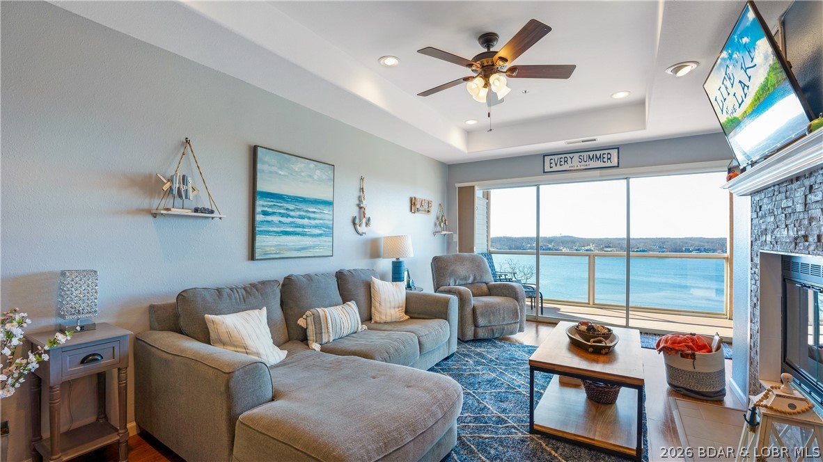 Located at the Lake of the Ozarks, this stunning turnkey 3BR/2BA end-unit condo offers the perfect blend of luxury, comfort, & investment potential. Featuring privacy, a coveted 12x36 boat slip, & an oversized covered deck w/breathtaking 180° Main Channel views, this is lake living at its finest. Enjoy peaceful sunrise mornings & unforgettable sunset evenings from your private outdoor retreat. Inside, the spacious primary suite showcases incredible lake views, while 2 additional guest bedrooms are thoughtfully separated for enhanced privacy & comfort. The open-concept living & dining area flows seamlessly into the beautifully updated kitchen, complete w/quartz countertops & panoramic lake views throughout. Natural light pours into every room thanks to the end-unit location. Additional highlights include private storage unit, oversized boat slip, & turnkey convenience, making this condo ideal as for full-time, weekend getaway, or income-producer. Located off Horseshoe Bend, you’ll have quick access to some of the Lake’s best dining, shopping, & entertainment. For breathtaking views, large boat slip, & move-in-ready lakefront retreat w/rental potential, this condo checks every box.