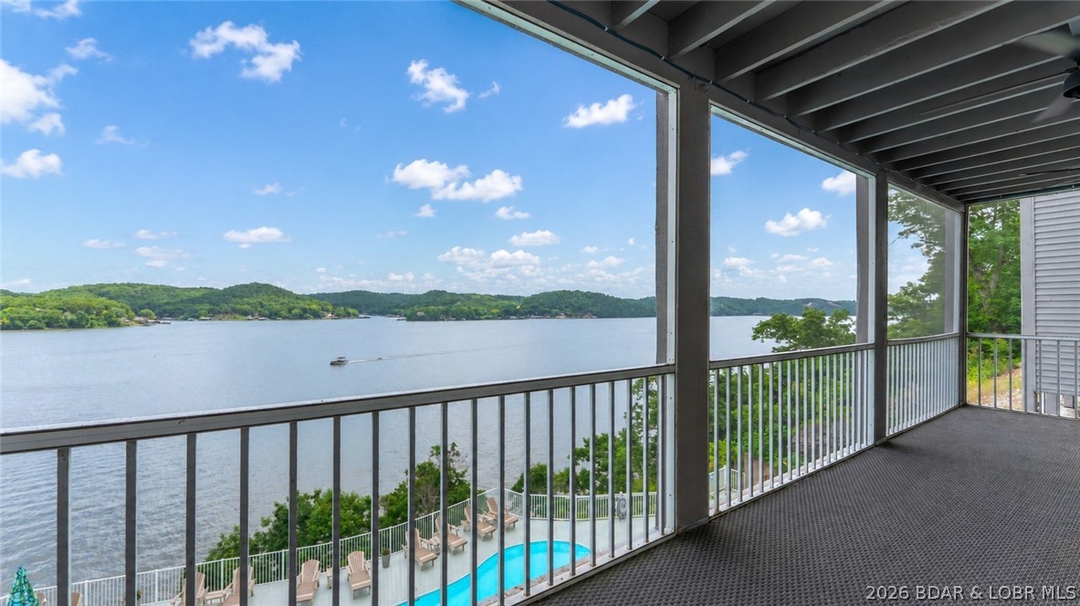 NOW OFFERING ALL HOA assessments for 2026 paid by seller upon successful offer!The VIEW is what sets this condo apart! Located at Windsor Bay Condominiums, this turn-key 3 BATH / 3 BATH end-unit offers breathtaking panoramic views of the Osage 34MM from its spacious screened-in & covered deck—perfect for enjoying the lake in any season. End-unit positioning provides additional side windows, filling the condo with natural light while maximizing the incredible lake views. All 3 beds feature private bathrooms & the larger-than-average kitchen offers abundant cabinet & counter space, rarely found in condo living. Includes a 10x30 boat slip WITH lift, PWC space (dock 3/slip 2L) & a private storage closet just outside the front door. The complex has recently undergone major improvements including a new roof, new siding, new railings & freshly sealed parking lot. Coming soon is a new pool liner & renovated pool deck scheduled for Fall 2026. Enjoy the lakeside clubhouse featuring a full kitchen, fitness equipment, games, fireplace & stunning lake views. The elevated pool deck offers some of the best views in the complex, while the docks are protected by a wavebreak for added peace of mind.