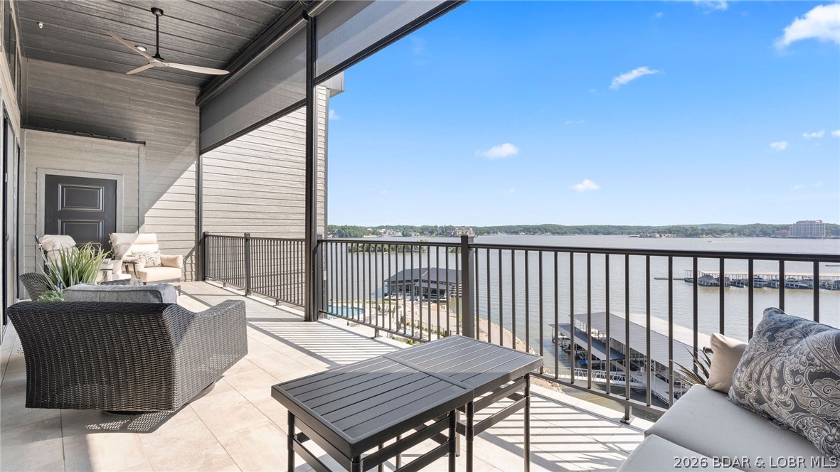 UPSCALE LAKEFRONT CONDO! Discover style with this 2023-built luxury condo located in one of the most sought-after locations, Horseshoe Bend! Offering panoramic lake views of the 13mm & a thoughtfully designed 1700sqft floor plan, this home is ideal for those who want views, comfort & quality without compromise. Step inside to open space with soaring high ceilings, custom craftsmanship including-custom cabinets, custom closets, custom lighting, custom electric blinds, & custom flooring for a seamless, premier look. The open-concept living area flows effortlessly to a spacious lakeside deck, perfect for entertaining or enjoying stunning sunsets. The 3 bedrooms is designed for comfort, while 3 bathrooms ensures convenience. Accessibility is a top priority, enjoy zero-step entry, ADA compliance, & elevator access—making it true easy lake living. This property includes a 12 x 40 boat slip(C1), a garage, trailer parking, & boat ramp for the ultimate lake experience. Lounge under the cabanas by the infinity pool, or hang out by the lakeside fire pit, this unit truly offers it all! Make it a full time lake escape, weekend retreat, or revenue opportunity from nightly rentals.