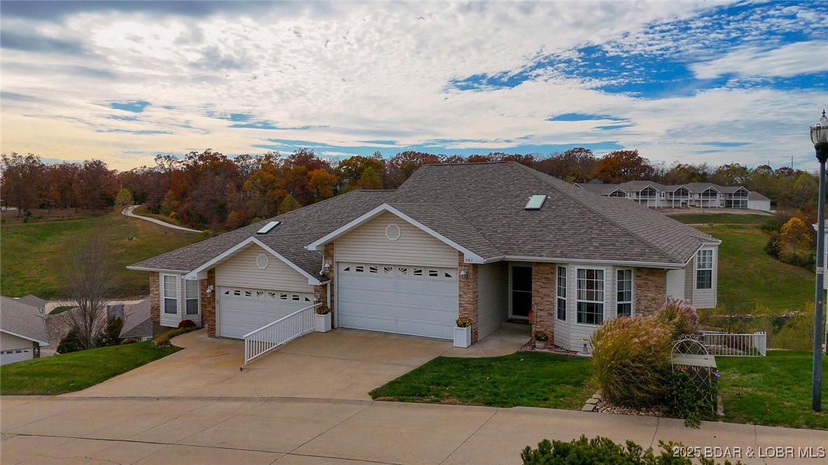 Discover comfort and convenience in this inviting 3 bed, 3 bath villa in the heart of Osage Beach. Enjoy two levels of living space designed for everyday ease and year-round relaxation. The main floor offers a bright kitchen with island seating, open to the dining and living area with a cozy fireplace and access to the screened deck overlooking peaceful ponds and fountains. The primary suite features a walk-in closet that connects directly to the laundry room—such a great perk—plus a guest bedroom (currently an office) and full bath. The lower level is an entertainer’s dream with a HUGE family room, space for a game area or additional sleeping, a full bar, guest bedroom and bath, and a second deck that leads to a fenced dog run. Attached 2-car garage AND highly coveted 10x30 boat slip is available for additional money. This is the perfect full-time home, lake getaway, or investment opportunity in one of the best locations at the Lake! Close to the hospital, the Elks, Dog Days, Dierbergs, many golf courses and shopping. Don't hesitate to bring us an offer to secure your piece of Lake Paradise before summer! Golf-cart included!