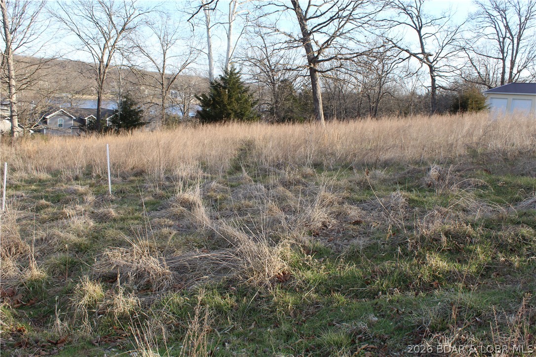 Nice lot in Johnson's Bay Subdivision overlooking Gladstone Cove near the 3mm of the Gravois Arm of Lake of the Ozarks. Community water and sewer already in place lowers the building cost for your new Lake of the Ozarks dream home!
