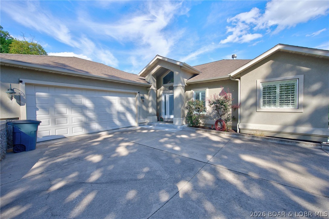 Location, Location, Location by car or boat it's close to everything. Vaulted ceiling and dramatic lakeside windows let natural light flood this four bedroom lakefront home. An inviting entry, with main level living, spacious kitchen and dining room with deck access. Add two lakeside bedroom suites and two living areas and you have a home ready for fun at the lake with all your friends and family. Step to lake a problem? You'll enjoy the convenience of a cart path from the driveway to the dock no more lugging all your gear to the dock. So many options to enjoy the lake, large decks, lakeside patio with firepit and BBQ, kitchenett on the dock with microwave, refidge and ice maker, ith over adjcet to the over sized swim platform. With 142' feet (per Real Tax) of waterfront you will enjoy a large area off swimmplatform to enjoy the lake,