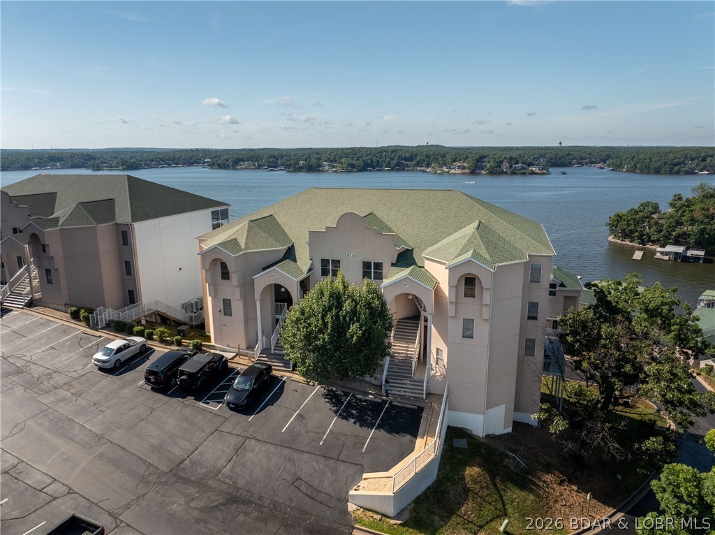 Welcome to your lake get away!! Check out this completely remodeled, top floor, turnkey Penthouse with amazing panoramic views of the 14MM. 
Emerald Bay is located less than two miles down Horseshoe Bend. This condo hosts four bedrooms, four bathrooms, sleeps 12 and over 2300 square feet. This unit is equipped with all new furnishing's, New SS appliances, Large covered screened in deck with new outdoor furniture. Let us add two boat slips and two 6x12 storage units. This condo has been beautifully remodeled and very tastefully decorated ready for new owners to enjoy! Let this be your Lake Escape, there is so much room and perfect for entertaining your family and friends. This condo comes turnkey and complete with a 12X36 boat slip w/hoist and a 10X24 slip with a dual PWC hoist ready for summer!! Here at Emerald Bay, there are two community pools, Club house, Tennis and Basketball courts and a fitness room. This condo would make a great rental property, vacation, or a full-time home, with all of the awesome furnishings. Schedule your appointment today!