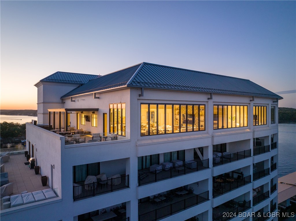 Fabulous Penthouse in the Lakes' Exclusive Luxury Condo Complex.  Cypress at the Lake.  Stunning Views for miles from the Roof Top Deck of this Twelve Story Building.  Private Elevator Entrance.  Five Bedrooms all En-Suite, and One Powder Room.   This Condo has it ALL.  Two Living Areas, One Formal and One Game / Entertainment Room, Both with Breath-Taking Views.  Open Floor Plan with 14 Foot Ceiling throughout.  Outdoor Deck area is nearly 1300 Sq Ft of Luxury Entertainment.  Large Covered Area with Large Screen TV, Large Luxurious Hot Tub and Fabulous Outdoor Furniture with Gar Firepit.   The Complex offers a Gorgeous Outside Pool and Deck area with Covered Cabanas, Area with Gas Cooking Grills, Cozy Sitting Area with Fireplace, Fitness Center and MORE.  Total Turnkey, this property includes Luxury Furniture and Decor, Two LARGE Boat Slips 16x54 and 14x40, Two PWC Slips and Three Reserved Spaces in the Parking Garage.  All Three Slips have New Boat Lifts and they are Available.
