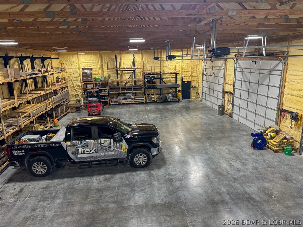 Rare opportunity on Hwy C in Versailles! This versatile 3-acre property offers endless potential with no restrictions and excellent location for residential, commercial, or mixed-use opportunities. The impressive 40x80 shop features a concrete floor, spray foam insulation, unfinished living quarters, and office spaces already in place. The property also includes a huge parking lot with plenty of room for customers, equipment, trailers, RVs, or future expansion. Whether you are looking to start a business, expand your operation, build your dream home, or create the perfect live/work setup, this property is ready for you.  Easy highway access, great visibility, and unlimited possibilities make this a rare find!