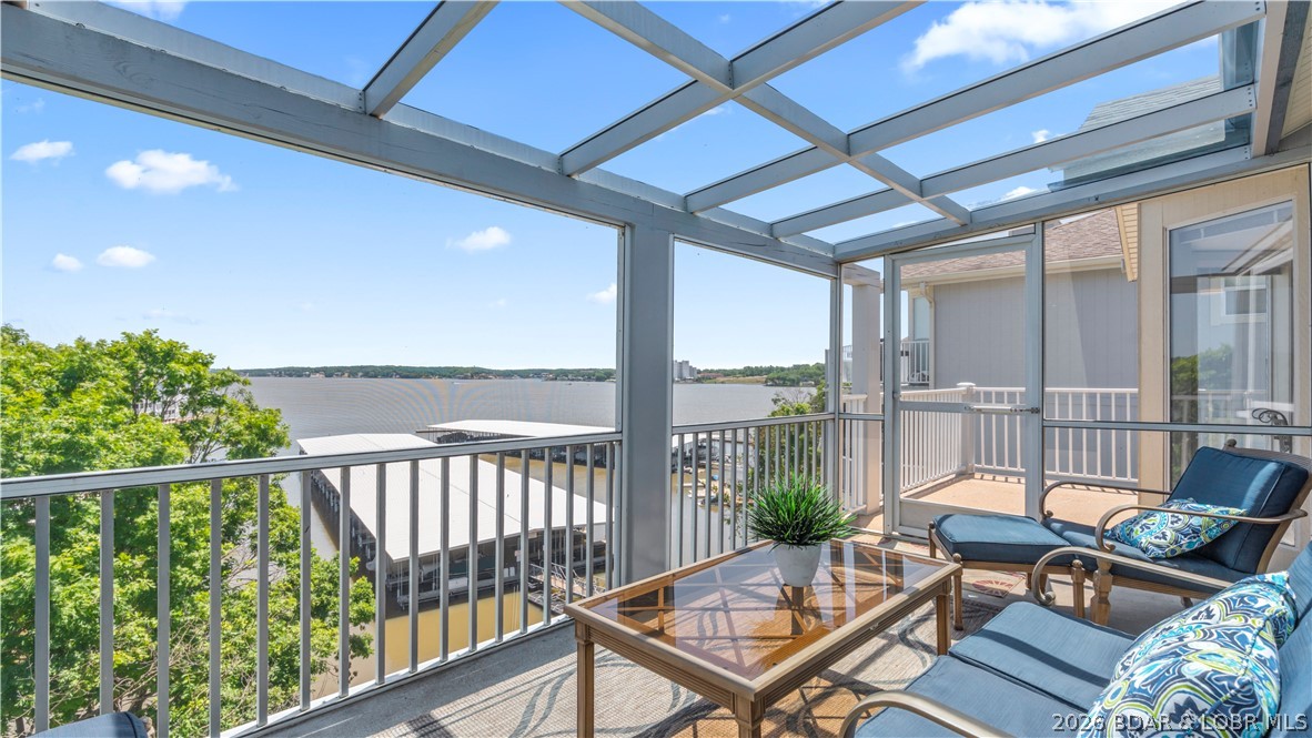 Beautifully updated 3-bedroom, 3-bath top-floor condo in Regatta Bay offering breathtaking main channel views at the 13 MM with stunning sunrises from the screened lakeside deck and sunset views from the private front deck. This fully turn-key unit features vaulted ceilings, open-concept living, abundant natural light, luxury vinyl plank flooring, fresh paint, fireplace, and tasteful furnishings throughout. Currently operating as a vacation rental property with excellent income potential, making it ideal as both a personal lake retreat and investment opportunity. Only one flight up with no unit above and only one shared side for added privacy. Recent exterior improvements include newly installed steel support columns, updated structural beams, and completed lakeside railing improvements. Includes a 12x30 boat slip with lift plus swim dock access right off the lakeside pool. Regatta Bay offers two pools, a lake swim dock, tennis courts, pickleball, picnic areas, fire pits, trails, playgrounds, weekend security, and allows gas grills. Walking distance to restaurants and less than 10 minutes from the Bagnell Dam Strip. Being sold furnished and move-in ready!