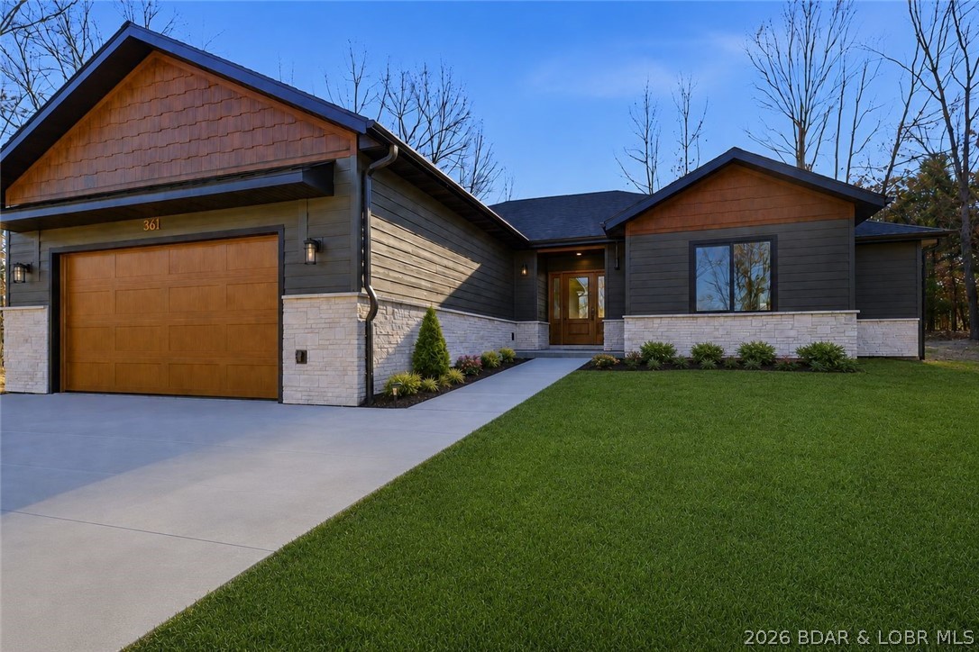 CURRENTLY THE BEST PRICE PER FOOT FOR A NEW HOME IN PORTO CIMA! Luxury Off-Water Living in Prestigious Porto Cima! This beautifully designed 3-bedroom, 2-bath home offers upscale finishes and exceptional curb appeal. Step inside to an open-concept layout featuring durable LVP flooring, soaring vaulted ceilings with stained beams, and abundant natural light. The stunning kitchen showcases high-end quartz countertops, cream cabinetry, a custom knotty alder island, large walk-in pantry, and premium finishes throughout. The spacious primary suite offers a spa-like bath with a custom walk-in shower, separate soaking tub, and an oversized walk-in closet. Two additional bedrooms and a generous second bath provide comfort for family or guests. Outside, the yard has been newly seeded and strawed, with fresh shot rock along the road frontage for a clean, polished look and improved access. The large driveway provides ample parking for guests. Harbor 19 may offer potential boat slip availability, giving buyers a convenient option for getting on the water. Enjoy the lifestyle and amenities of Porto Cima.