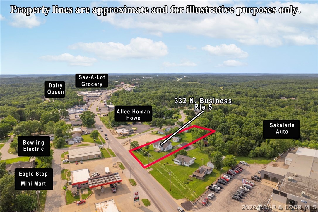 Prime Commercial Property in Camdenton! This versatile property offers a unique opportunity to live and work in the heart of Camdenton. Featuring a spacious house with basement, large garage, and a trailer used as an office, this property sits on 3/4 acre with high visibility, making it an ideal location for both residential and commercial use. Whether you're looking to make it your home or operate your business, the possibilities are endless. Don't miss out on this prime location with easy access to the area's main routes and a steady stream of traffic!