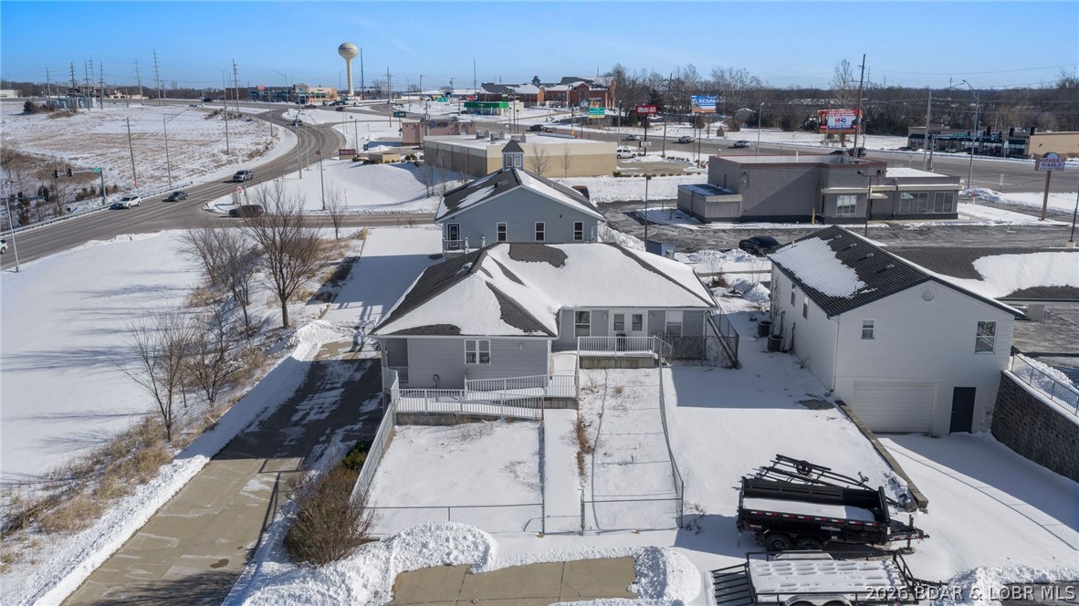 This is a POWERHOUSE listing!! Exceptional high-traffic commercial investment opportunity at one of the most prominent intersections at Lake of the Ozarks. The prime corner location delivers maximum visibility, consistent vehicle count exposure, and strategic positioning in the heart of a thriving commercial corridor. Featuring TWO commercial buildings totaling over 4,200 square feet, this property offers flexibility for multi-tenant income, owner-user occupancy or redevelopment potential. The layout supports a variety of commercial uses including retail, professional office, or service-based operations. With strong frontage, superior signage opportunities, and immediate access to surrounding retail and attractions, this is a rare chance to secure a cornerstone property in a high demand market. Opportunities in locations like this are limited-especially at intersections that anchor long-term commercial growth!!!