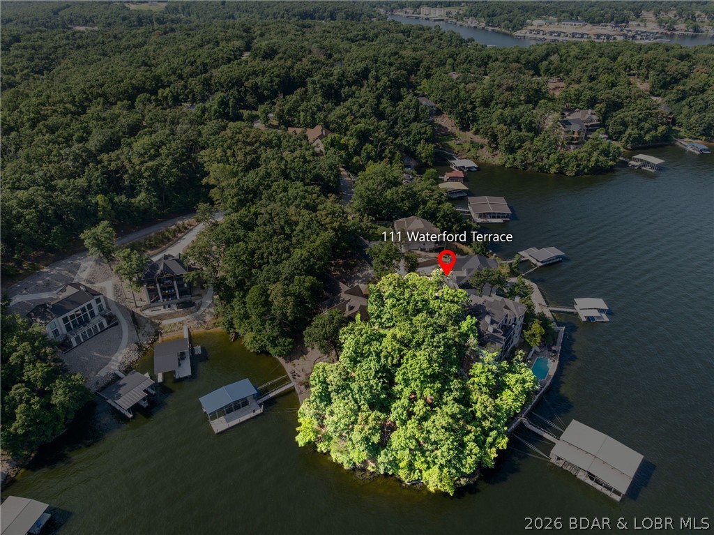Welcome to one of Porto Cima’s most extraordinary point lots on the 14 MM  — offering 233 feet of private shoreline and sweeping main channel views that simply take your breath away. Positioned at the end of a quiet cul-de-sac in the prestigious Grand Sub Point subdivision, this rare offering is the canvas for a show stopping luxury residence. Imagine walls of glass capturing panoramic water views… a resort-style infinity pool overlooking the channel… a custom dock extending from your shoreline… and front-row seats to The Lodge fireworks lighting up the sky. This is more than a homesite — it’s a lifestyle. Enjoy upscale Porto Cima amenities including pickleball and tennis courts, and cruise by boat in minutes to Paradise Restaurant, Lake House 13, Tap & Grill, and more.
Opportunities like this — on one of the lake’s most coveted points — are exceptionally rare. Secure your legacy property at Lake of the Ozarks. Call for a private showing today!