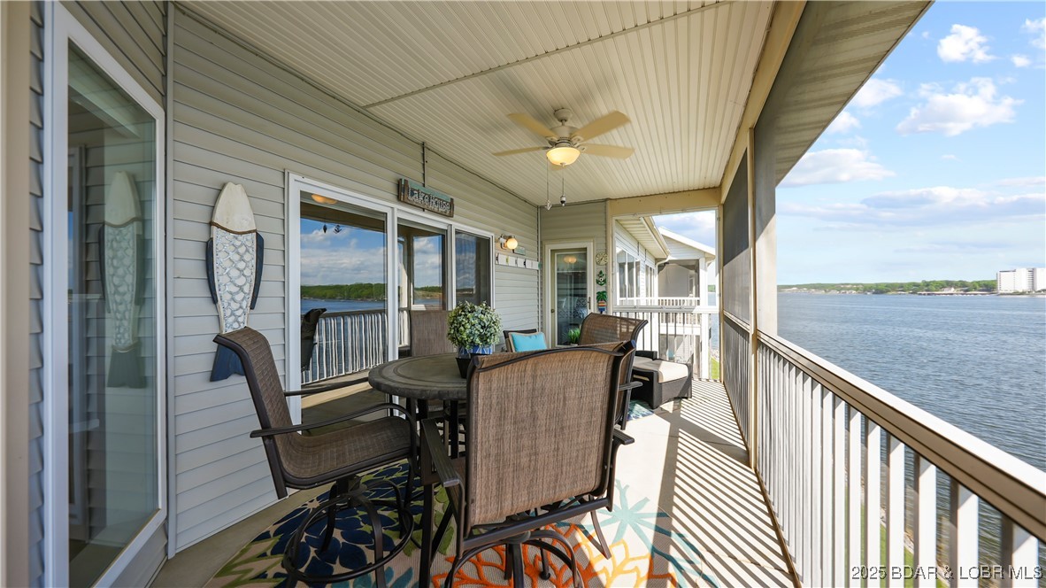 Welcome to this stunning 3 Bed/3 Bath top-floor condo at the highly desirable Regatta Bay! Completely remodeled and offered turn-key, this home is located in the coveted Point Building, giving you unobstructed panoramic views of the main channel at the 12MM—you’re literally sitting at the water’s edge. The open-concept layout is filled with natural light and features an updated kitchen, stacked stone fireplace, and a spacious screened-in porch perfect for entertaining or relaxing. Sold fully furnished and tastefully decorated, it also includes a large laundry room, extra storage, and a charming front porch sitting area. Looking for an investment? Regatta Bay allows nightly rentals, and currently has GREAT rental history. A rare 15x42 slip with 21,000 lb Titan hoist & Captain’s Choice remote is included. The complex offers 2 pools, dog park, playground, and more—all in a prime Horseshoe Bend location near top restaurants, golf, water bars, and the Bagnell Dam Strip. This seller is MOTIVATED! Don't miss out on this opportunity!