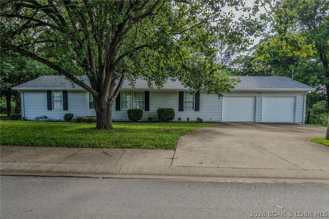 LOCATION AT ITS BEST CONVENIENT TO ALL AREAS IN THE SOUGHT AFTER OSAGE BEACH, MO.. THIS UPDATED HOME offers 
3 BEDROOMS, 2 FULL BATHS,  MASTER SUITE with a WALK IN CLOSET, DOUBLE VANITY IN THE BATH,  ATTACHED 2 CAR  GARAGE W/MINI SPLIT UNIT. MANY MODERN FEATURES, VINYL PLANK FLOORING, NEWER INTERIOR PAINT, UDATED KITCHEN CABINETRY & COUNTERTOPS, LIGHTING FIXTURES,  WOOD BURNING FIREPLACE IN THE LIVING ROOM  LARGE REAR DECK PERFECT FOR ENTERTAINING. A DOUBLE CORNER LOT  .78 ACRES ML,  THIS LOW MAINTENANCE EXTERIOR MAKES FOR MORE RELAXATION and FUN TIME AT THE LAKE. DON'T HESITATE ON THIS ONE.....MAKE THE CALL TODAY !!