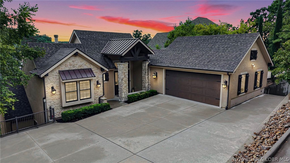 Luxury isn't always defined by modern trends—it can also be found in timeless craftsmanship that simply can't be duplicated. Nestled on over a half-acre with 144' of lakefront in a protected deep-water cove, this remarkable Porto Cima estate offers over 6,400 sq. ft. of warm, inviting living space filled with stunning custom wood beam ceilings, handcrafted cabinetry, and architectural details that set it apart from today's cookie-cutter homes. Designed for entertaining, the chef's kitchen features commercial gas range/ovens, double refrigerators/freezers, two dishwashers, hidden walk-in pantry with serving station, and oversized granite island. Four bedroom suites, including two luxurious primary suites, provide exceptional comfort. The lower level offers a theater/family room, wet bar, and seamless access to an incredible outdoor living area with tiled covered deck and fireplace. The spectacular dock features a bar, storage, two party areas, 14x48 and 12x32 slips plus dual covered PWC slips. An exceptional Porto Cima value under $3M that's as unforgettable as the memories you'll create here. *3 yr old custom blt dock located at 733 Muirfield will be moved over before closing*
