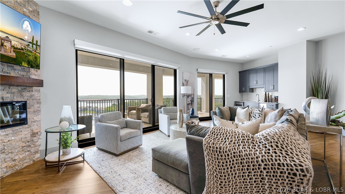 Welcome to unparalleled luxury at Cypress at the Lake, widely recognized as THE premier condo development at Lake of the Ozarks perched at the Osage 12MM. Offering the 2nd largest floor plan in the complex, this stunning property captures breathtaking panoramic lake views from an 880 sq ft east-facing balcony, the perfect place to enjoy spectacular sunrises each morning. Every bedroom offers lake views with its own en-suite bath, while upscale finishes include 8' solid core doors w/ upgraded trim, custom Ozark closet systems, Harris blackout shades, Sonos ceiling audio, Ferguson lighting, K. Renae premium furnishings, wet bar with ice maker, dual water heaters & full KitchenAid appliance package with Instahot faucet. Enjoy unmatched amenities including an infinity pool, cabanas, lakeside firepit, green egg grilling station, fitness center, parking garage, high-speed elevator, backup generator for complex & overall just a stunning clubhouse area. Also includes 16x48 slip with 24,000lb poly lift & walk-around platform with remote.