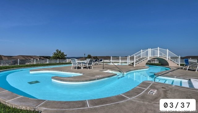 Lakefront living, vacation getaway, or investment opportunity—this beautifully maintained 3-bedroom, 2-bath condo at sought-after Lands End offers it all! Previously used as a successful rental and offered partially furnished, it's ready to enjoy or continue generating income. The open-concept living, dining, and kitchen area features breathtaking main channel views, perfect for entertaining or relaxing after a day on the water. Recent 2025 updates include new luxury vinyl flooring in the living room and a new HVAC system. Elevator access from the parking lot makes arrival easy for owners and guests. Enjoy resort-style amenities including a cove-side pool, lazy river, clubhouse, fitness center, playground, and boat trailer parking. The included 12x36 dock slip is protected by wave breaks, making days on the lake even more enjoyable. Conveniently located near waterfront restaurants, shopping, a trampoline park, and family attractions, this condo is the perfect full-time home, vacation retreat, or income-producing investment. Don't miss this exceptional Lake of the Ozarks opportunity! Motivated Sellers