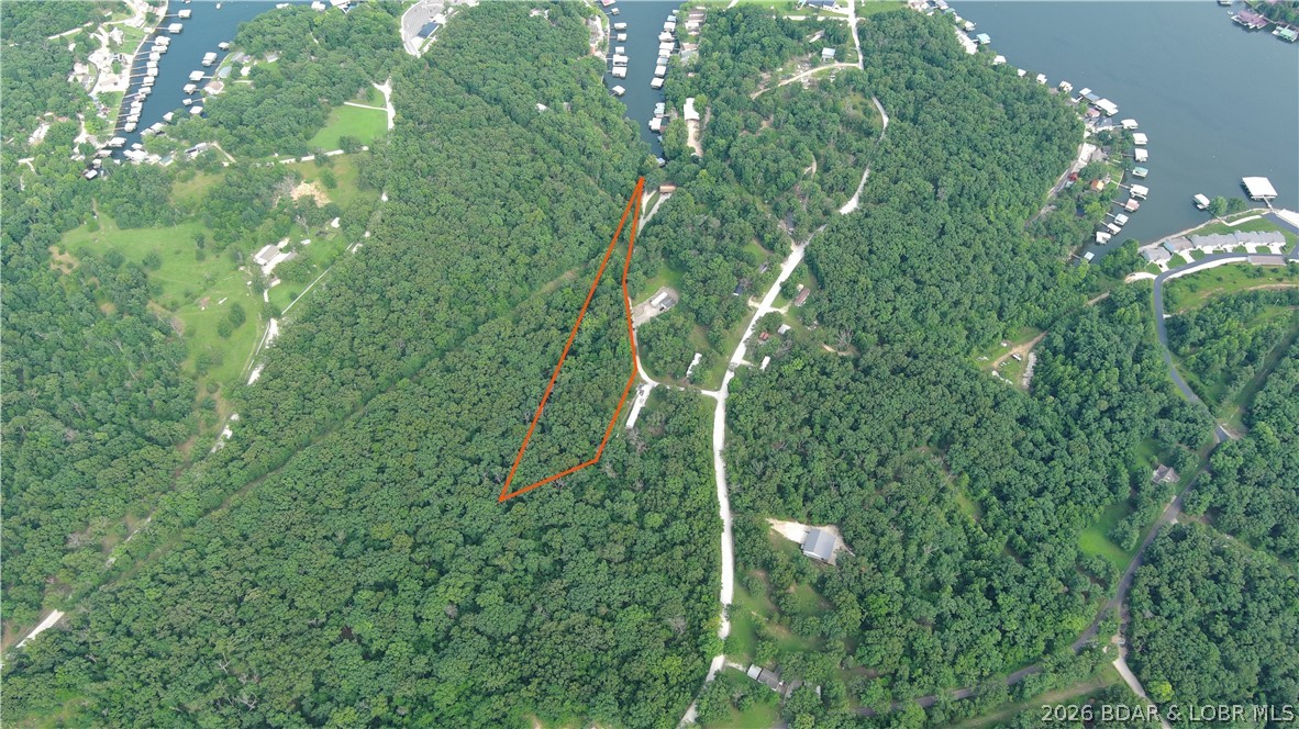 LAKE LIFE STARTS HERE!  Looking for the perfect place to build your getaway or forever home? This beautiful 5.69-acre property offers the best of both worlds- privacy and easy access to the lake!  Property features 40+ ft of water frontage.  5.69 acres, plenty of room to build. Shared well, with well agreement in progress, close to Lake Burger, convenient access to a nearby boat ramp, endless opportunities for fishing, boating, and relaxing on the water.  Whether you're dreaming of weekend escapes or a peaceful place to call home, this property is ready for your vision.  Don't miss your chance to own your own slice of lake paradise!
