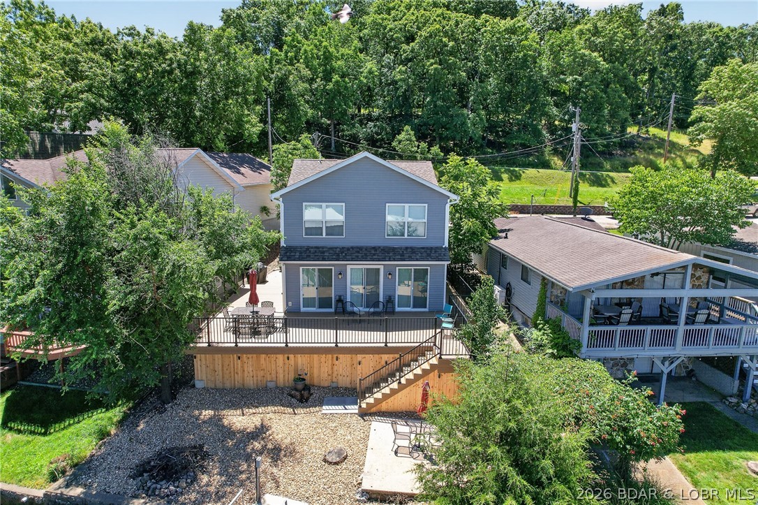Ready to enjoy lake life from day one? This Beautifully updated 4 bedroom, 2 bath home in desirable Chimney Cove offers the perfect blend of comfort, convenience, and waterfront fun.  The brand new 14X34 Timber Tech deck low maintenance, built to last with new footings, railings, lights and electric run to the dock. Perfect for entertaining and relaxing with spectacular lake views. Current owners purchased the property to create their dream lake house and invested heavily in upgrades--then a rare opportunity came along, making this your chance to benefit from all the improvements!