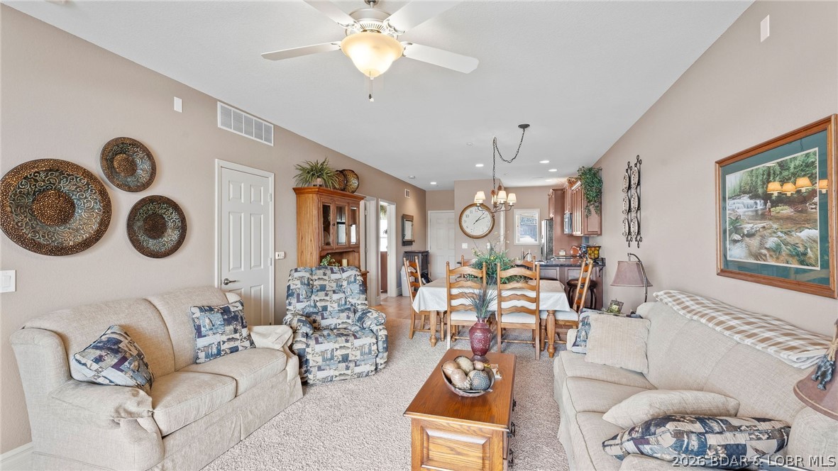 ELEVATOR and NO STEPS UNIT! Rarely used Turn-Key Lakefront Condo! This immaculate 3 bedroom 3 bath condo offers amazing views of the 3mm in beautiful Lake of the Ozarks! Completely furnished, meticulously maintained, and move-in ready its new owners! This large condo feels like a house with all three bedrooms as ensuites, offering 9ft ceilings, large windows, nice walk-in closets, and walk-In showers. The kitchen offers custom cabinets, granite countertops, stainless appliances, and soft close drawers and doors. Walk-in unit from the parking lot, and no steps to your 12 x 36 boat slip with 4,000lb lift! Annual rentals provide a serene and comfortable living experience. This unit offers convenience and fun located close by land to NautiFish Rum Bar and across the cove to The Cave Bar & Grill by water. Enjoy this summer making new memories with the kids! Don't miss this one, units with elevators don't last long!