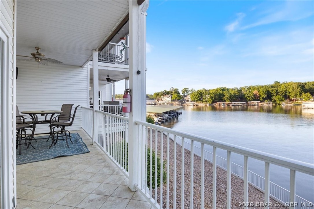 WALK IN UNIT!  Experience easy lakefront living in this beautifully maintained 3-bedroom, 2-bath condo located in a peaceful cove in Lake of the Ozarks. Offering 1,391 square feet of single-level, step-free living, this property is ideal as a full-time residence, weekend getaway, or income-producing investment.  Enjoy breathtaking views of the Osage Arm poolside, where stunning sunsets set the scene for relaxing lake days. Situated in a protected cove, this location is perfect for swimming, boating, and enjoying everything lake life has to offer. Nightly rentals are allowed, creating excellent short-term rental potential.  The community features a pool, convenient building-level parking, and a low-maintenance lifestyle for both owners and guests. Included with the unit is a generous 14’ x 40’ boat slip along with an additional PWC slip, making it easy to get out and enjoy the water.  HOA dues cover cable, internet, dock reserve, road maintenance, sewer, water providing hassle-free ownership.  Whether you’re searching for a turnkey investment opportunity or the perfect lakeside retreat, this condo checks all the boxes.