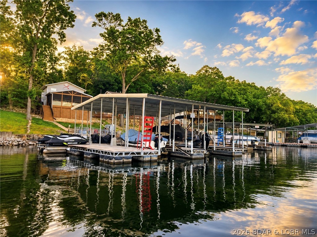 If you’ve been looking for that true turnkey lake house where you can show up and immediately start enjoying the lake life, this is it. This beautifully remodeled 3 bed, 2 bath lakefront home has been thoughtfully updated and comes fully furnished with high-end furnishings, making it completely move-in ready from day one.

One of the best features of the home is the incredible expanded living space with the screened-in glass area that feels like an extension of the kitchen and living room. It’s the perfect spot for morning coffee, family dinners, game nights, or simply relaxing while taking in the lake views year-round.

Outside, the lake setup is hard to beat. The dock has room for 2 boats and 2 jet skis, giving you plenty of space for entertaining friends and family and making the most of every lake weekend. The brand new composite decking adds even more outdoor space with low-maintenance convenience.

Located on blacktop roads all the way to the home, access is easy and convenient year-round. Short-term rentals are allowed, making this property an amazing opportunity whether you are looking for a personal lake retreat, a full-time home, or a investment property.