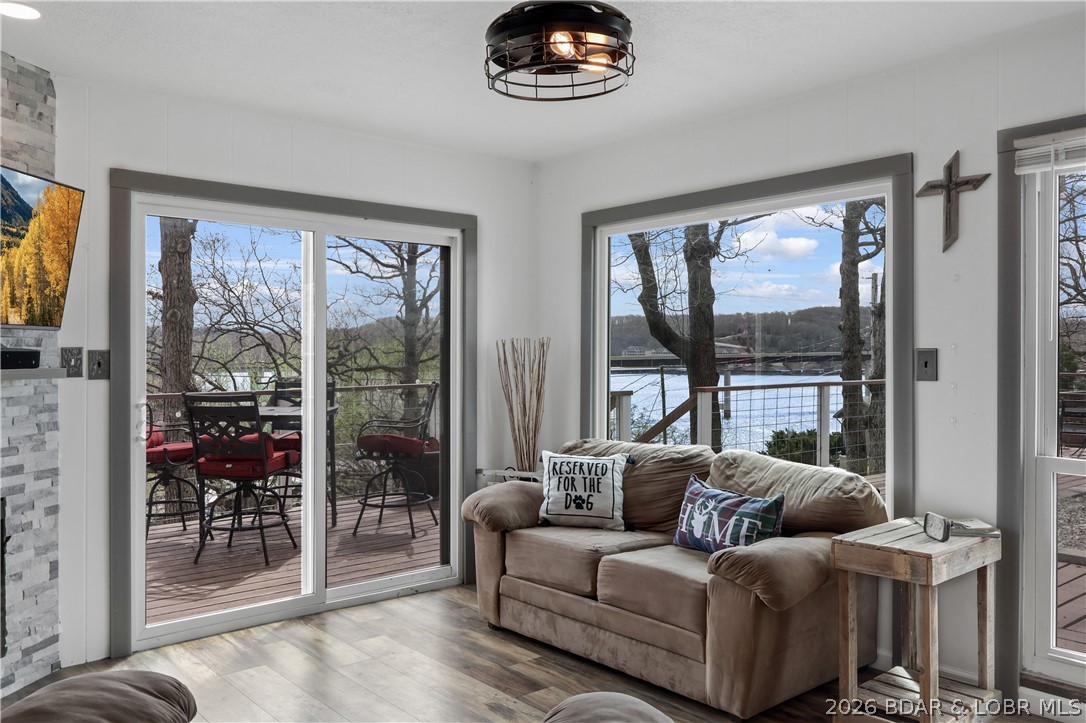 NEW PRICE! GREAT Lake View  & large deck • Updated • Turn-Key • Boat Slip Included! Located in Sunrise Beach at the 34MM near Hurricane Deck Bridge, this 2BR/1BA, 2nd-tier lake view/access home is an excellent value for full-time living, a weekend getaway, or investment, NO rental restrictions, NO HOA! Remodeled (2023–2025) new roof, gutters, flooring, paint (in/out), deck additions, windows, doors, plumbing (PEC lines), electrical, kitchen (cabinets, counters, backsplash, appliances), and a beautifully updated bath with heated floors and full-body shower system. Features include attic fan, good insulation, washer/dryer, basement/workshop, firepit,& plenty of parking with area prepped for a future garage. Includes 10x21 boat slip with lift—easy walk to community dock. Minutes to Captain Ron’s, Branding Iron, Groceries, shopping, marinas & more. 10 min to Camdenton & Laurie. Fun, friendly lake location!