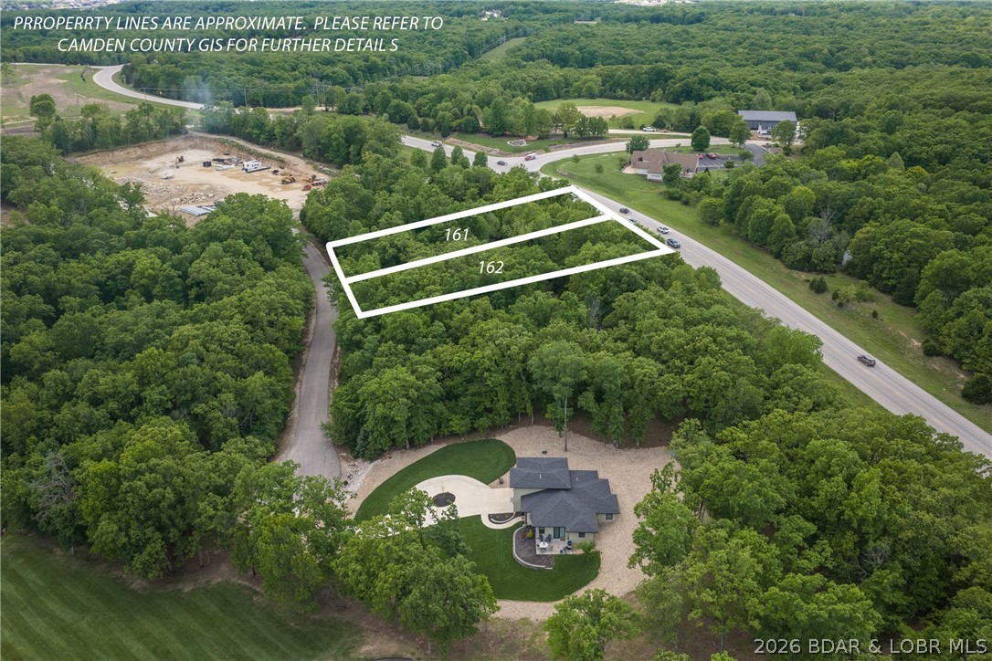 Affordable building lot in Porto Cima. Your chance to have a homesite in one of the nicest golf course subdivisions in the Midwest. Porto Cima is truly the finest golf and boat community in the Midwest. It is a short distance to both the marina and clubhouse. Buy your lot today and start planning your home of tomorrow. Gentle lot with great access and topography. Different types of memberships available.  This lot is a great value, come start your home today.  If you like this lot the one directly next door is available also.  Start both homes at the same time to save cost and increase efficiency.