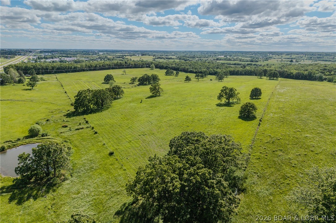 BEAUTIFUL 72+ ACRE FARM!! Located just a mile from city limits on the mother road of Route 66- This property features GREAT PASTURE, GOOD FENCES, CROSS FENCES, ideal for your cattle needs, Switchgrass, Indian grass, & other native warm grasses- then enjoy the wooded areas perfect for hunting adventures. You'll also find a LIVE SPRING, THE CREEK, & TWO STOCKED PONDS; the property has I-44 visibility and offers great potential for your new business.