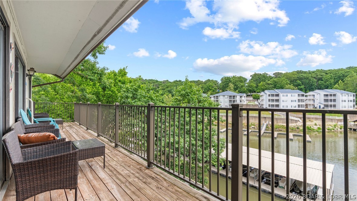 Welcome to this top floor end unit at Waters Edge Condominiums,  where you’ll experience a standout lake lifestyle featuring a scenic lakefront walking and golf cart path, a swimming pool, playground, fitness center, and both tennis and pickleball courts. This 2 bed, 2 bath condo includes beautifully updated bathrooms with walk in showers for added comfort and style. Perfect for rentals—this condo's location, convenience, and amenities make it highly attractive to vacation renters. Situated in a golf cart-friendly area, you’re just minutes from The Cove and The Ridge golf courses, plus only a short boat ride to local favorites like Lake House 13, Franky & Louie’s, and Backwater Jacks. If you’re looking for an affordable lake retreat with top-tier amenities and a boat slip, this condo is definitely worth a look! Call for a private showing today!
