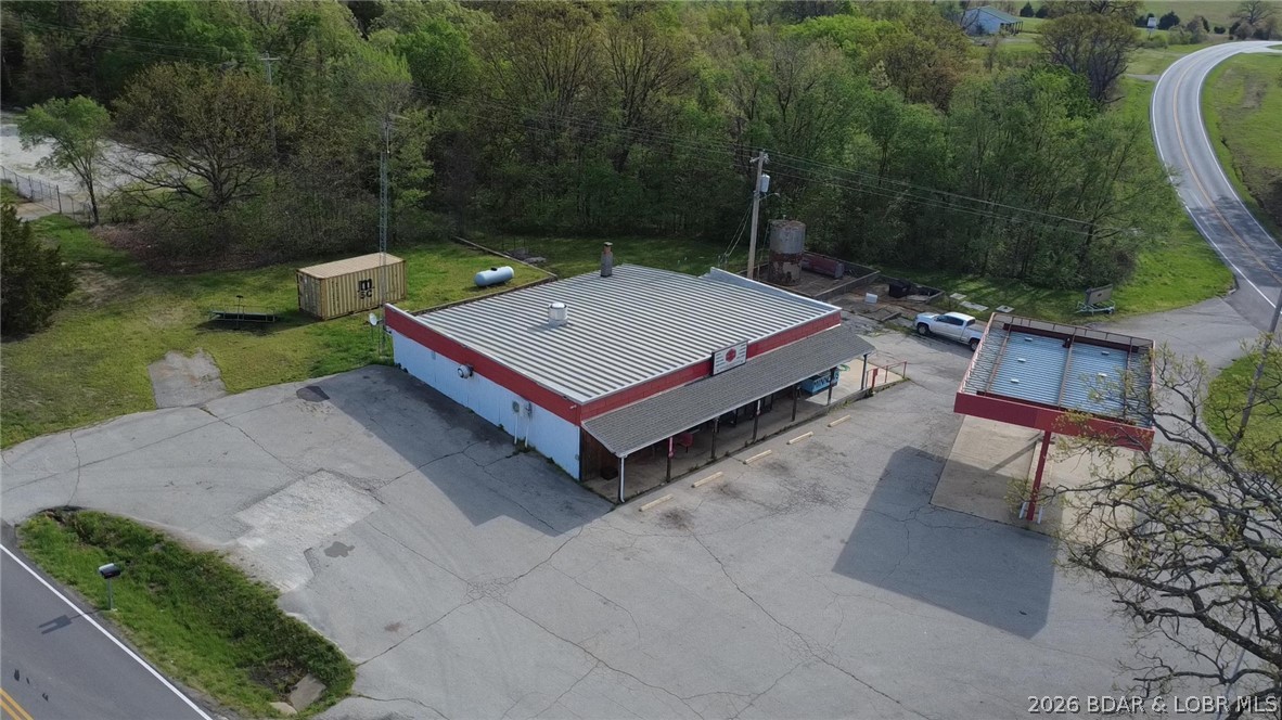 Major Price Improvement - Fantastic value for prime commercial space at Lake of the Ozarks! Located at the busy intersection of State Hwy 7 and Hwy Z going up to Coffman Bend, this versatile property— set up to operate as a convenience store with pizza ovens, commercial fryers, and ice cream freezers, reach-in beverage fridges and more. — boasts excellent visibility for year-round customer flow. Enjoy easy access from both highways, plenty of parking, on level asphalt paving. This property is a flexible space ready for new life as a diner, coffee shop, boutique retail store, brewery, gas station, dealership, event venue, or farmer’s market. Ideal for investors or entrepreneurs, the open layout easily supports a variety of successful business models.
More than just a building, this is your opportunity to revitalize a beloved Lake of the Ozarks site with your vision. The store is ready for its next chapter as spring brings renewed energy to the area. Motivated seller — contact today to unlock the full potential of this prime location! Call for a showing or more information anytime.