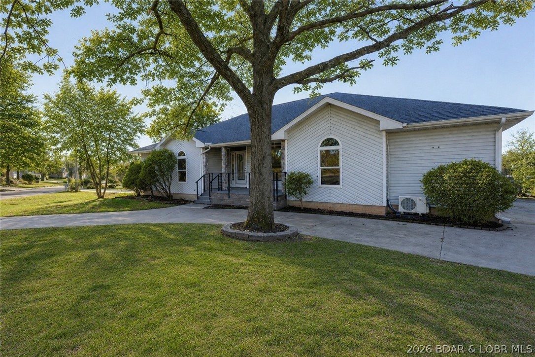 Ideal layout for a home in a great subdivision in Camdenton! This 4bed / 3.5bath home sits on half an acre, abundance of space, convenience & great location. Main level living home, features hardwood & tile floors throughout, big living/kitchen/dining rooms & a stunning four-seasons room with a wall of windows that walks right out to your open composite deck & cable railing system. Even has a fenced in back yard that's accessible from the main level. Newer HVAC & water heater & newly remodeled primary suite featuring a gorgeous spa-like bathroom, including a huge walk-in tile shower. Two 2-car attached garages; a main level & lower level with workshop space—perfect for cars, toys & hobbies! Walk-out lower level offers mother-in-law quarters with separate entrance, plumbed & ready for kitchen, family room, bedroom & full bath. It even has it's own storage/laundry! Home is efficient, abundant amount of parking, beautiful landscaping & move-in ready! Easy access to Hwy 5, located just outside of Camdenton, close to grocery, restaurants & right across from Ozarks Amphitheatre—enjoy concerts from your porch! Homes like this don't hit the market often, especially in Watkins subdivision!