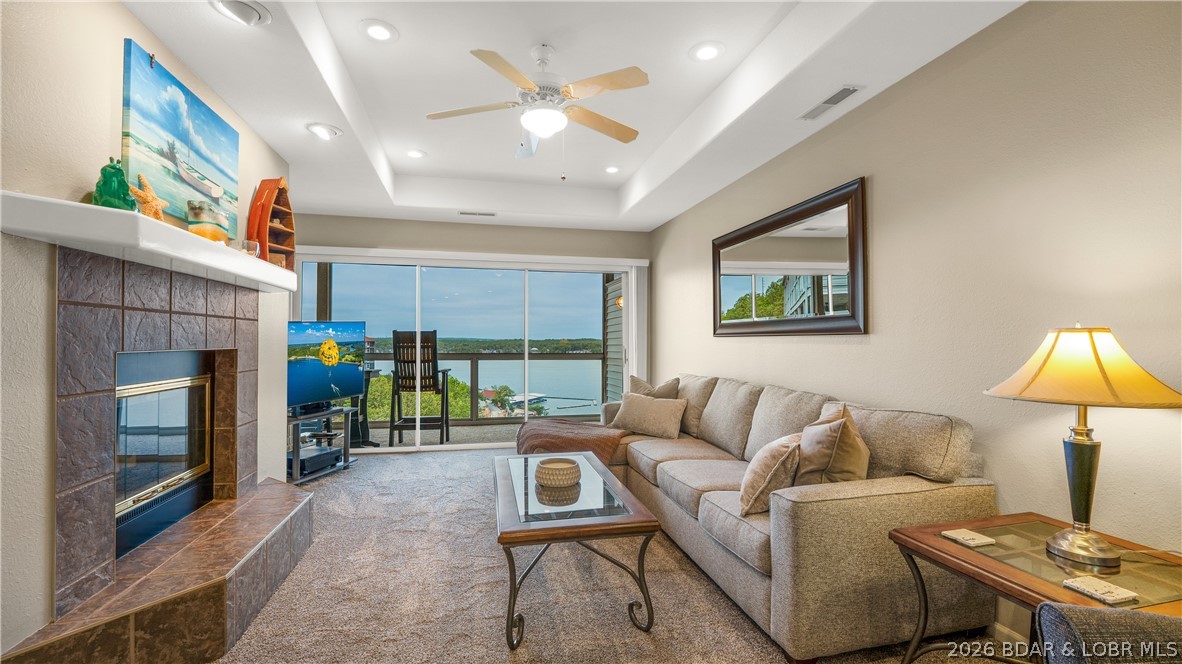 Life here naturally centers around the beauty of the lake. Unobstructed main channel views stretch for miles, creating a backdrop that never gets old. The screened deck quickly becomes your favorite spot, whether it’s a quiet morning with coffee or an easy evening unwinding after time on the water. From sunrise to sunset, the lake is always yours to enjoy. Inside, the open-concept layout is designed to maximize natural light and lake scenery, creating a space that feels bright, connected, and comfortable for both everyday living and gathering. Boating is effortless with a 12x32 boat slip, 10,000 lb lift, and a PWC slip included, giving you easy access to the best the lake has to offer. Located in Emerald Bay at the 14-mile marker, just off Horseshoe Bend, you’re perfectly positioned in the heart of Lake of the Ozarks, with quick access to top-tier dining, shopping, and entertainment. Every detail reflects how well this home has been cared for. Never used as a rental, this condo has been personally enjoyed and meticulously cared for over the past 13 years. An 11x12 storage unit on the back side of the building adds extra convenience. Ready to enjoy with endless income potential!