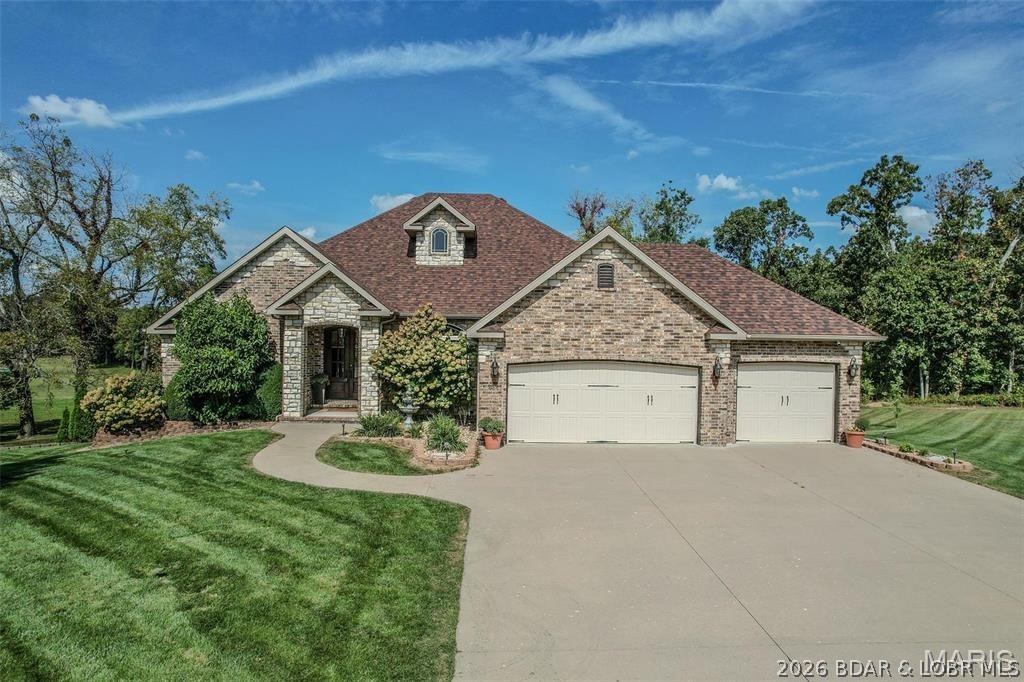 Welcome to this all-brick home nestled in Castle Rock Estates! Where craftsmanship and thoughtful design shine throughout. From the tall ceilings to the elegant fixtures and brick backsplash in the kitchen, every detail has been carefully considered. Step through the entryway into a bright and inviting living room featuring a brick fireplace, large windows that fill the space with natural light, and gorgeous flooring that adds warmth and character. The formal dining area provides the perfect setting for gatherings and special occasions. The kitchen is a chef’s dream, offering stainless steel appliances, custom cabinetry with abundant storage, and a charming coffee bar. The spacious primary suite serves as a relaxing retreat with tray ceilings, a dual vanity, a walk-in shower and soaking tub, two closets, and access to the partially covered deck for peaceful mornings or evening relaxation. The main level also features two bedrooms and another full bathroom. Downstairs, the walk-out basement expands the living space even further with two additional bedrooms, two full bathrooms, two living areas, and a kitchenette — perfect for guests, entertaining, or multi-generational living.