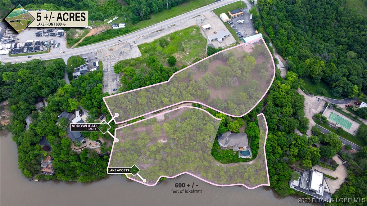 Step into luxury with this unique 5+/- acre residential property, offering an impressive 596+/- feet of lake frontage, complete with a concrete golf cart path/boardwalk to access the waterfront. This exclusive property combines convenience and accessibility with the privacy and seclusion only a waterfront estate can offer. The terrain is a picturesque blend of bluffs and lush trees, all set against the breathtaking backdrop of the Lake of the Ozarks. With its unconventional features and stunning views, this property is more than just a place to live—it’s a lifestyle waiting to be embraced. Perfect for those who seek to combine upscale living with a touch of the extraordinary, it promises a daily panorama of serene lakefront and rugged landscapes. This is the final prime lakefront property available in Lake Ozark.This is not just a property; it's the foundation for your dream life by the water.