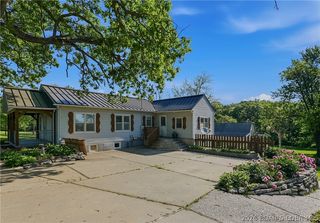 Sitting on approximately .78 acres in a convenient Eldon location, this 4-bedroom, 2-bath home offers a great opportunity for someone looking for space, potential, and a property they can make their own. With mature trees, a large yard, and a spacious back deck, the outdoor setting provides plenty of room to entertain, or enjoy the extra privacy the lot offers.

TLC making it a great option for buyers wanting to build equity over time. The layout offers flexibility with multiple bedrooms, a basement for added storage or usable space, and a large parking pad with room for several vehicles, trailers, or recreational equipment. Whether you're looking for an investment opportunity, a fixer-upper, or a home with room to customize, this property has solid potential in a desirable location.