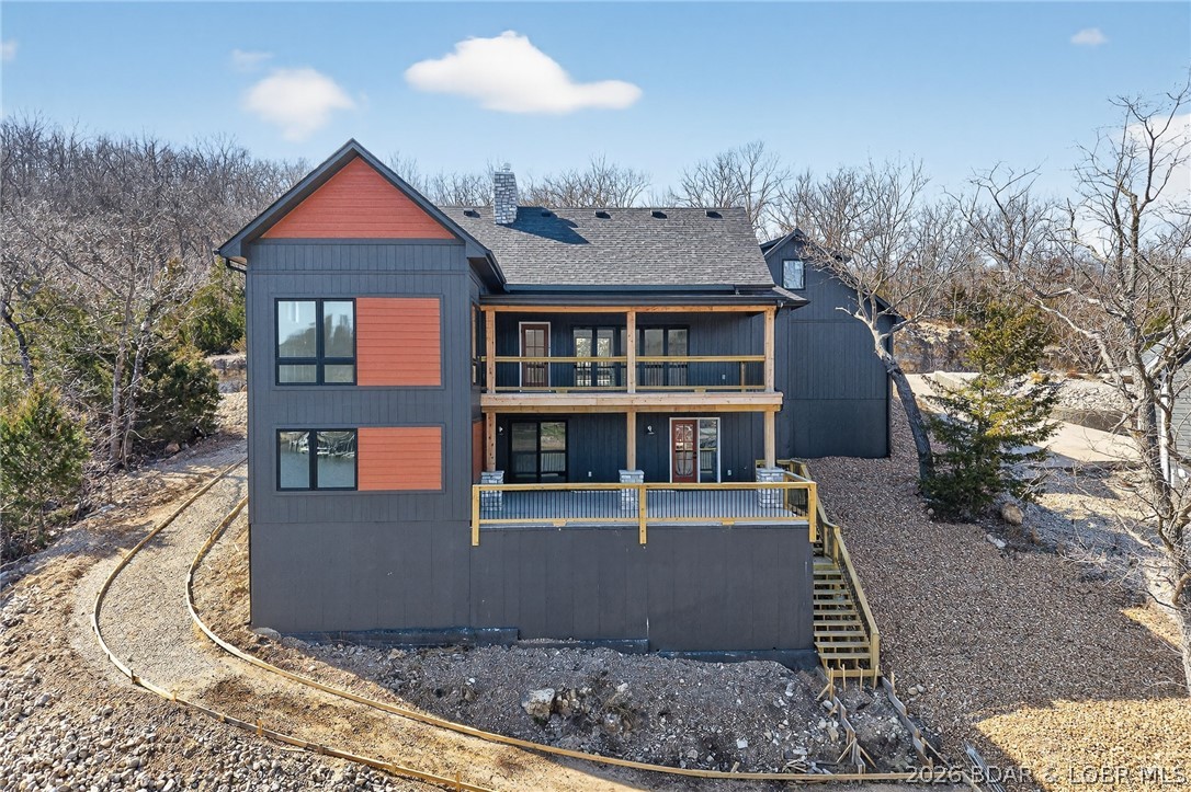 BRAND NEW!! This stunning home offers an abundance of space and comfort. You will love the effect the wooden beams create in the great room. This main level features large windows and custom full glass moving wall doors that afford killer views and open the house to accommodate inside /outside entertaining. Let the kids enjoy themselves in their own private bunkroom, keeping the lower level open for guests. The concrete cart path to the waterfront is currently being installed.  Don't miss out on this great home.  Cove location in an upscale subdivision. Private boat ramp and community area for trailer storage.