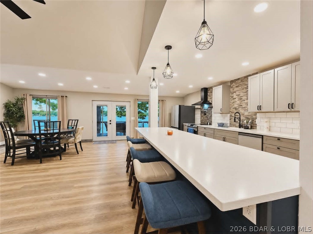 Beautifully positioned near the water’s edge, this fully remodeled (2024) 4-bedroom, 3-bath home offers exceptional lakefront living in a prime location with no restrictions. Enjoy breathtaking main channel views and 100 feet of shoreline at the 10MM. The main level features a spacious and well-designed floor plan, including an expansive primary ensuite, a second bedroom, full bath, open-concept kitchen and living area, and convenient main-level laundry. The upper level offers two additional bedrooms, a full bath, and a generous bonus space off the third bedroom—ideal for a bunk room or non-conforming fifth bedroom. Additional highlights include an attached one-car garage, ample parking, and a private dock with a 12x42 boat slip. If you need a bigger dock, Ameren permitted for 36x40. For those seeking additional investment or multi-family opportunities, the neighboring property MLS# 3587056 is also for sale. Schedule your private showing today to experience this exceptional lakefront property.
