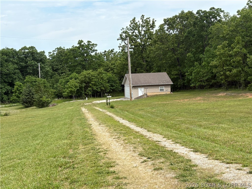 O road location, close to all conveniences, 24 x 24 low maintenance garage that is fully insulated, concrete floor, heated and cooled by 10,000 BTU window unit.  Sitting on 1.04 acres of newly surveyed gentle laying land, this property is ready for your new home.
A shared well has just been installed. It will be up to the buyer to connect the well.   City sewer is at O road for hook up.  200 feet of O road frontage, but sits back from the road.