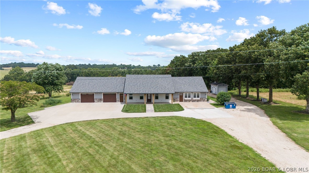 Welcome home to your own private slice of the countryside! Nestled on 5 beautiful acres, this stunning 5-bedroom, 3.5-bath home offers exceptional space, quality, and the peaceful lifestyle you've been dreaming of. Immaculately cared for and beautifully updated, every inch reflects pride of ownership. The thoughtfully designed floor plan features generous, light-filled living spaces, gorgeous tile bathrooms, a stunning travertine sunroom, and quality finishes throughout. Step outside to enjoy the hot tub, pool, breathtaking country views, and unmatched privacy. Extra-large garages, a dedicated craft and hobby area, abundant attic storage, and a built-in gun safe provide plenty of room for hobbies and storage. With numerous updates, including a newer roof, you can move in with confidence. Whether hosting family and friends or simply enjoying the peaceful surroundings, this exceptional property offers space, privacy, and amenities that are truly hard to find.