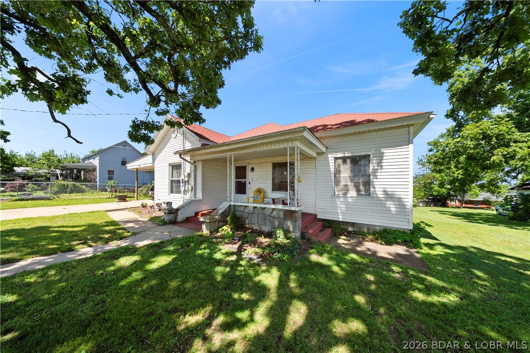 Welcome to this charming starter home, a rare opportunity that doesn’t come along often! Nestled in a peaceful, quiet neighborhood, this property is full of potential and ready for its next owner to make it their own. From the moment you arrive, you'll appreciate the cozy covered front porch - the perfect place to enjoy your morning coffee or unwind at the end of the day. Inside, you'll find a large living room that offers plenty of space for relaxing and entertaining. The spacious sunroom provides additional living space filled with natural light and endless possibilities for a home office, playroom, hobby area, or second living room. With a functional layout and room to add another bathroom, this home offers exciting opportunities to customize and add value over time. Whether you're a first-time homebuyer, investor, or someone looking for a property with room to grow, this home is packed with potential. Enjoy the benefits of a quiet setting while still being conveniently located just 20 minutes from the lake, making weekend getaways and outdoor recreation easily accessible.