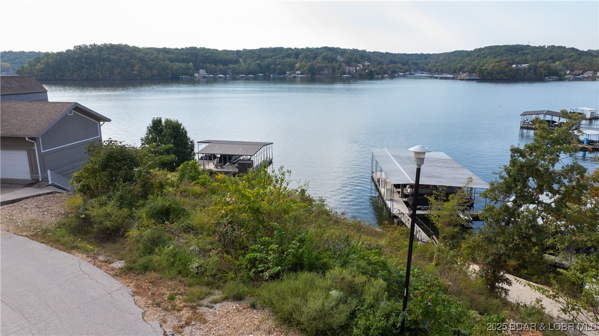 Lakefront living at its Finest! 
Check out this beautiful lakefront property featuring  main channel views. Located in a quiet, established subdivision, this rare find offers both tranquility and convenience-just minutes from shopping, restaurants, and local attractions. 
Take advantage of the option to install your own private dock.
Don't miss the chance to build your Dream Lake Home in one of the areas most desirable locations.