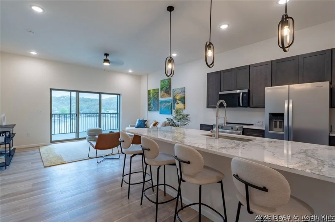 Priced under $400,000! Don't miss this incredible opportunity to own a brand-new 3-bedroom, 3-bath condo in Ember Ridge, one of Lake of the Ozark's newest resort communities. This bottom-floor unit features a spacious screened porch, durable all-steel construction, and a prime location just minutes from lakefront dining and entertainment. Boat dock slips are available for purchase. Whether you're looking for a full-time residence, vacation home, or weekend getaway, this low-maintenance new construction lake condo offers exceptional value at an unbeatable price.