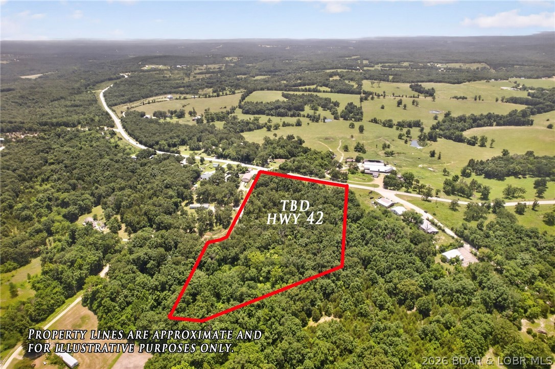 Discover the perfect blend of natural beauty and outstanding development potential with this 9.5± acre tract just 10 minutes from Osage Beach. Offering easy access from Red Oak Drive and approximately 450 feet of Highway 42 frontage, this property is ideal for a private estate, commercial venture, or investment opportunity. The gently rolling acreage provides a picturesque setting with excellent visibility and convenient access, making it well suited for a variety of uses. Looking to expand your vision? A neighboring commercial parcel is also available for purchase, creating even greater possibilities for development or a larger business footprint. Rarely does a property offer this combination of location, accessibility, highway frontage, and future potential in one of the Lake area's fastest-growing corridors.