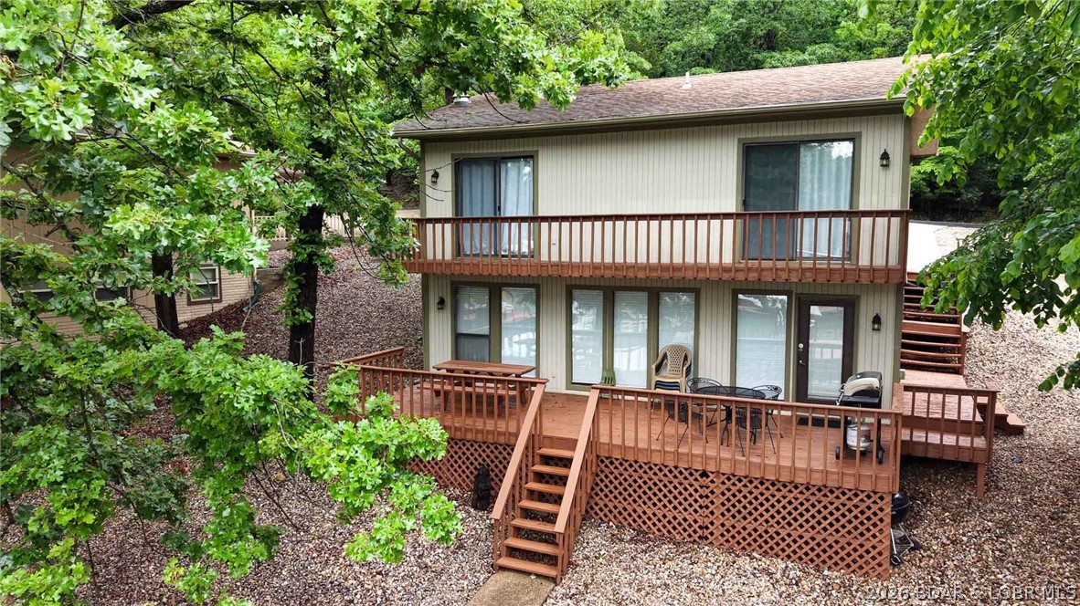 Welcome to lake living at its best! This must-see 3-bedroom, 2-bath home offers the perfect combination of comfort, convenience, and investment potential. Located on paved roads with an attached 2-car garage, this property is ideally situated close to some of the Lake’s most popular waterfront destinations including Shady Gators, Horny Toad Entertainment Complex, Franky & Louie’s Beach Front Bar & Grill, and Tap & Grill.  Currently operating as a successful VRBO, this home has performed very well as a short-term rental, making it an excellent opportunity for investors looking for income potential. Whether you’re searching for a profitable vacation rental, a weekend getaway, or the perfect place to make lasting memories with family and friends at the Lake, this property checks all the boxes!