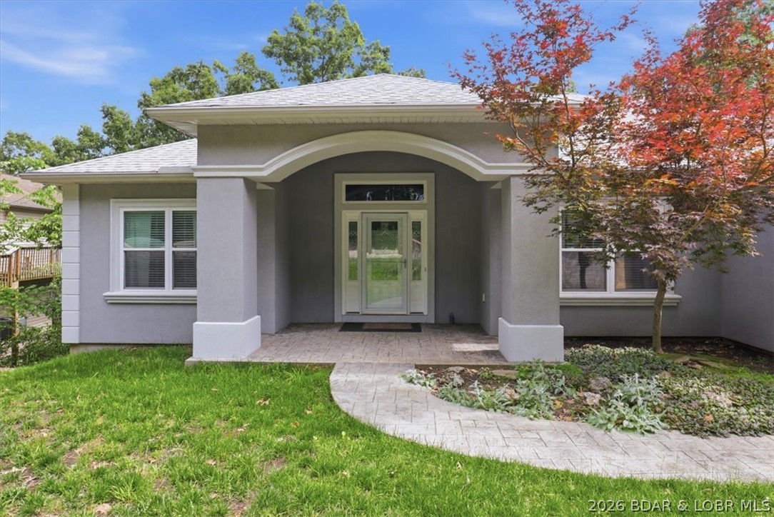 OPEN HOUSE THIS SATURDAY! Welcome to this spacious 5-bed, 4-bath lakeview home in the coveted Four Seasons community, offering over 2,700 sq ft of comfortable, well-designed living space. The main level features vaulted ceilings, ceiling fans, and large rooms throughout, including a living room with a cozy fireplace and a beautiful lakeview. The kitchen, dining room, and breakfast nook create an inviting flow, with a door leading to the expansive deck—perfect for entertaining or relaxing as boats pass by. Main-level living includes 3 bedrooms, 2 bathrooms, and a convenient laundry room.

The finished lower level adds exceptional versatility with 2 bedrooms, 1 bath, and a bonus room ideal for a family room with a lakeview, game room, office, or hobby space. Sliders open to the backyard, offering easy outdoor access. A 3-car garage provides abundant storage with tool chests that stay. The home also boasts a newer HVAC system and roof. Located close to all Four Seasons amenities, this property delivers lakeview living, space, comfort, and community in one of Lake Ozark’s most desirable areas.
