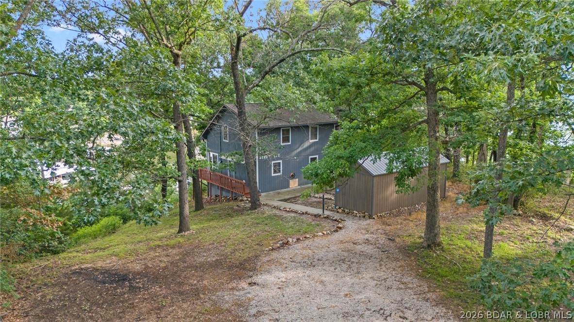 Lake life is calling! Wake up to beautiful lake views in this beautifully remodeled 3-bedroom, 2-bath home that's all about easy living and making memories. Updated in 2020, you'll love the fresh, modern finishes while still enjoying the warm, cozy feel that makes you instantly feel at home. Start your mornings with coffee on the spacious porch, spend your evenings watching the sunset over the water, and soak in the peaceful surroundings. Tucked away for extra privacy, this home offers the perfect escape while still being close to everything you need. Need room for all your lake toys and gear? You'll appreciate the basement storage for all the extras, plus a storage shed outside that's perfect for fishing equipment, paddleboards, tools, or seasonal items.
Whether you're looking for your full-time lake home, a weekend getaway, or a property with great income potential, this one checks all the boxes. It would make an excellent short-term vacation rental or long-term investment property, giving you plenty of flexibility. Just bring your bags and start enjoying the lake life!