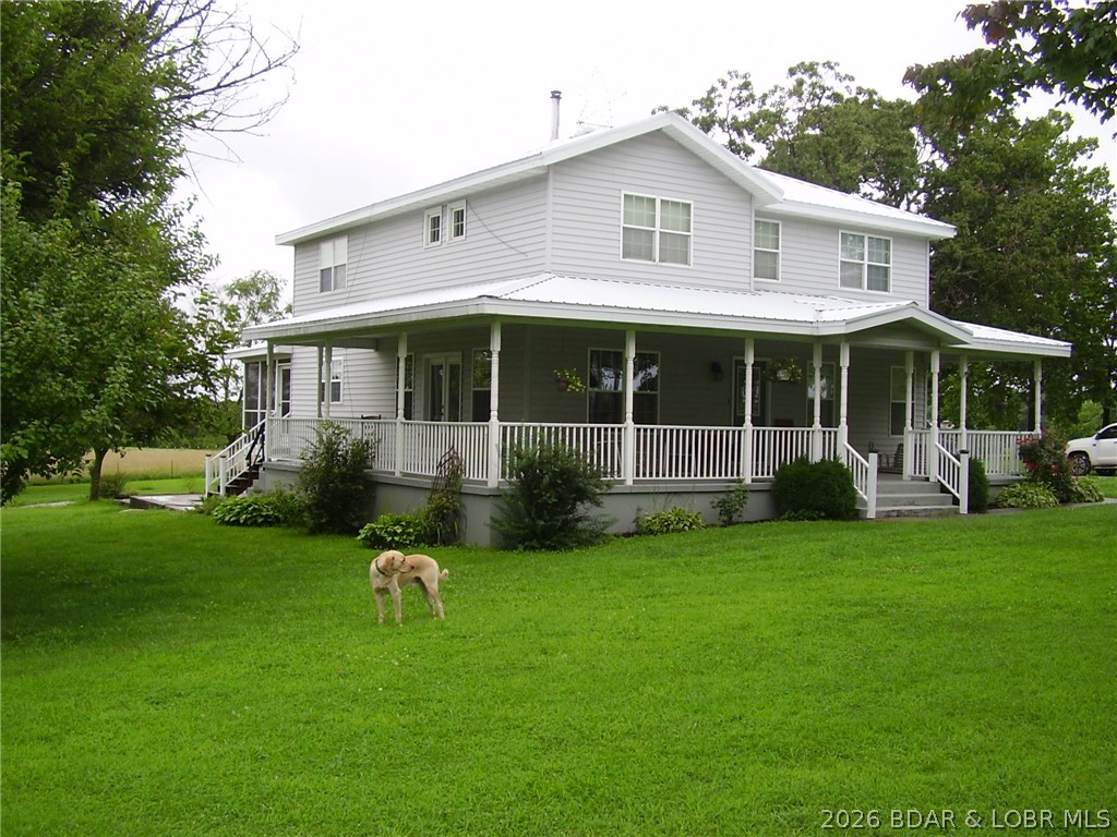 WoW!!! What a Nice Farm Folks !! Beautiful setting !!!!! Home is 3 bed 2 1/2Ba. Big Country Kitchen open Floor plan with Lg. Dining and family area!! Lg. Stone Gas Fireplace and Tall Vaulted ceiling with balcony for reading/sewing area and 2 Bed rooms and baths up stairs. Lots of Wood floors. Screened back porch over looking the Farm land. Front of Home is Lg. covered porch 2 sides. Shouse has 720 sq ft+-Living area 2 bed 1 ba. has Propane Heat and central air & 1056 sq ft shop area that is really all set up nice !!! The land is All open pasture and all fenced/ cross fenced for livestock. Lg Pond with stocked with big fish. Too much to mention about this Beautiful Farm Folks A Must see !!!!! Total 40Ac.... 38 ac is Owners name and 2nd Parcel is 2 Ac Bus. name ..Louisburg, Mo address and Halfway Schools.(If you need more land there is 40 ac tract next to the property with well Electric and lagoon that can be bought for xtra $285,000)